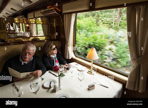 Passengers diners in dining car aboard Hiram Bingham train car carriage near Ollantaytambo ...