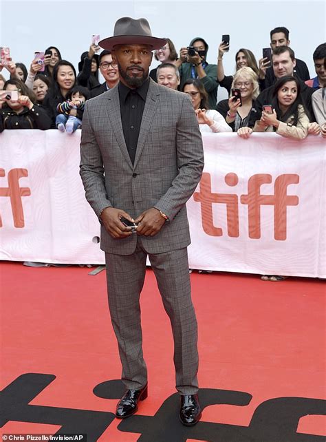 Jamie Foxx puts on a dapper display in grey suit and panama hat for the Toronto Film Festival ...