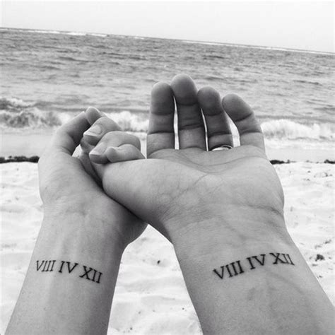 Matching Roman Numeral Wrist Tattoos