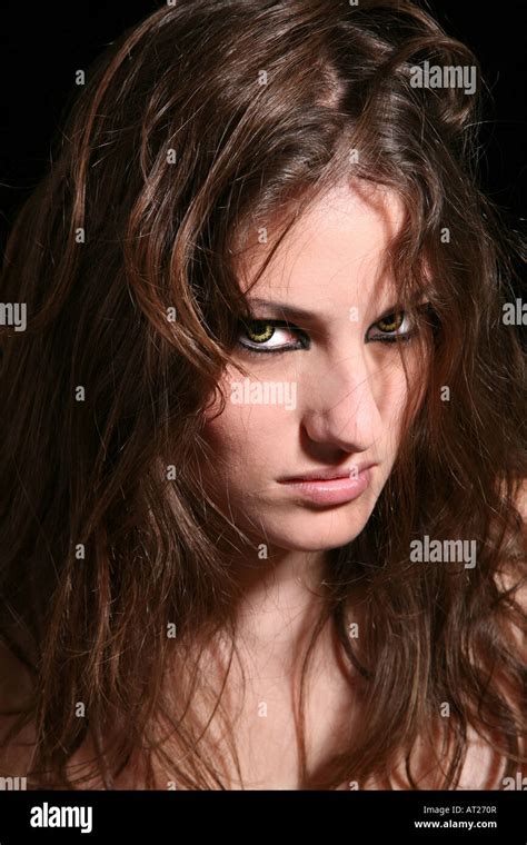 Pretty brunette with scary wolf eyes Stock Photo - Alamy