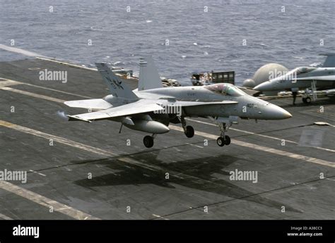 F A 18 Hornet landing on aircraft carrier Nimitz CVN 68 Stock Photo - Alamy