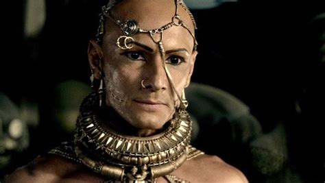 an image of a man in costume with chains on his head and face, looking at the camera