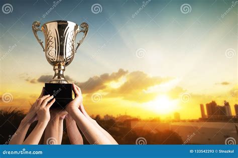 Winning Team Raise Trophy Cup with Background of Sky of Light Ra Stock Image - Image of success ...