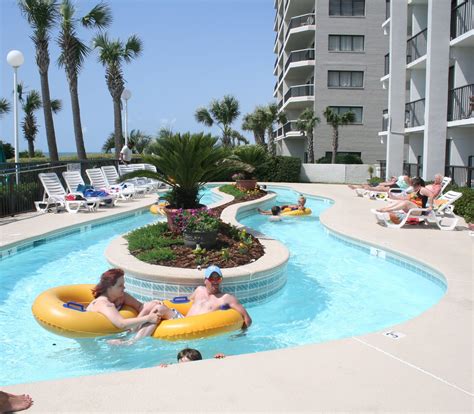 Enjoy a float around the lazy river at Grande Shores, the best oceanfront Myrtle Beach hotel for ...