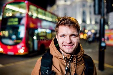 Man Walking In The Streets Of London At Night Stock Image - Image of smiling, busy: 73919729