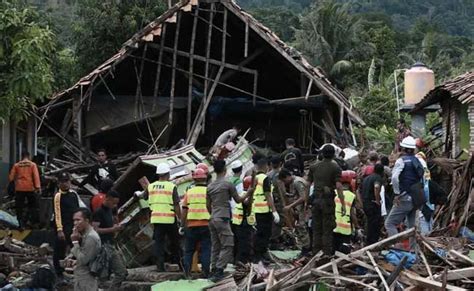 Hunt For Tsunami Survivors As Indonesian Rescuers Battle Heavy Rain