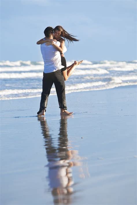 Couple Having In Romantic Embrace On Beach Stock Images - Image: 12415684