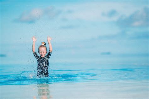 Little Girl Splashing Water - Stock Photos | Motion Array