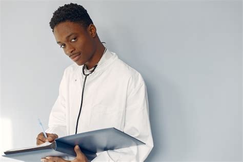 Free Photo | Black doctor in a white uniform with a stethoscope