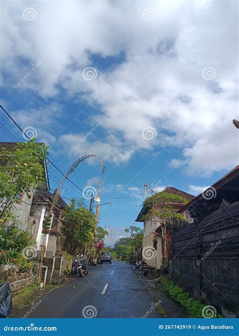 Wet Road After The Rain In The Sakenan Tabana Bali Village Housing With Penjor Decorations ...