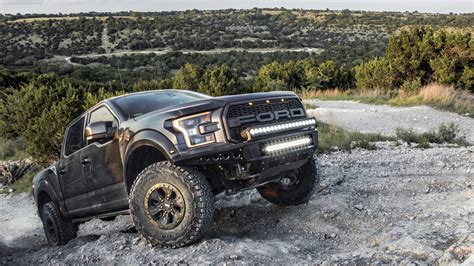 AUSTIN, UNITED STATES – Mar 13, 2019: Amazing Pictures of a Black Ford Raptor Truck going off ...