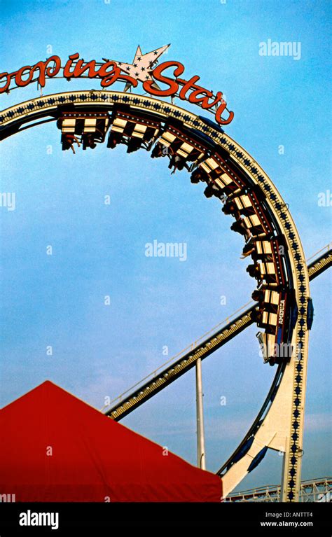 Roller coaster riders at a Texas state fair Stock Photo - Alamy