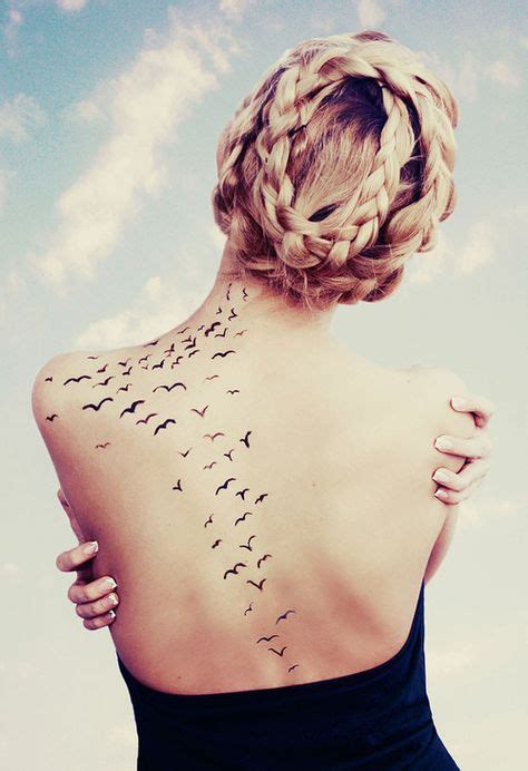 Tattoo of birds flying away | Tattoos, Waist tattoos, Beautiful tattoos