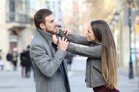 Angry couple fighting in the street | People Images ~ Creative Market