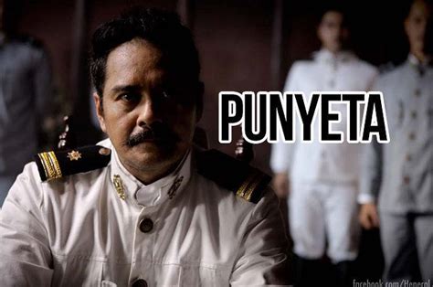 a man in uniform standing next to other men with words that say punyeta