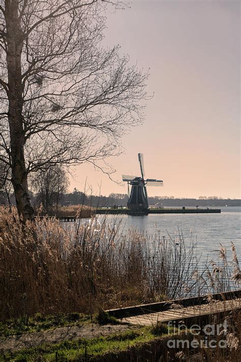 Windmill on a lake in the Netherlands Photograph by Patricia Hofmeester ...