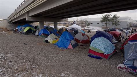 Migrants look for shelter in Denver as temperatures dip below zero | CNN