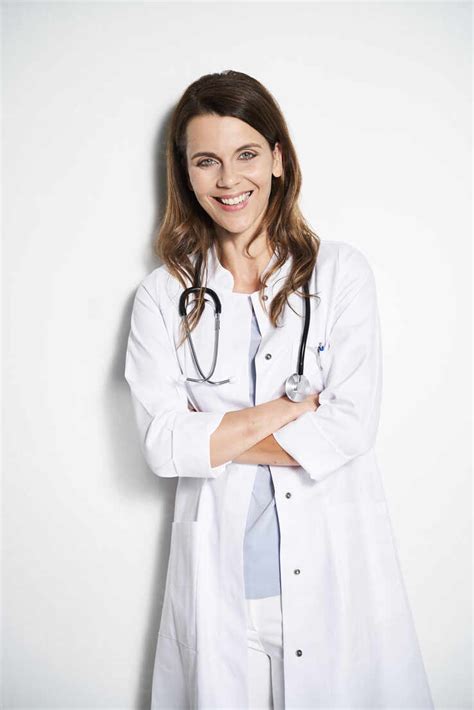 Portrait of smiling female doctor with stethoscope stock photo