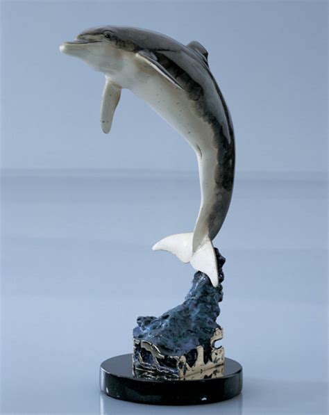 Robert Wyland dolphin statue, water by Robert Wyland