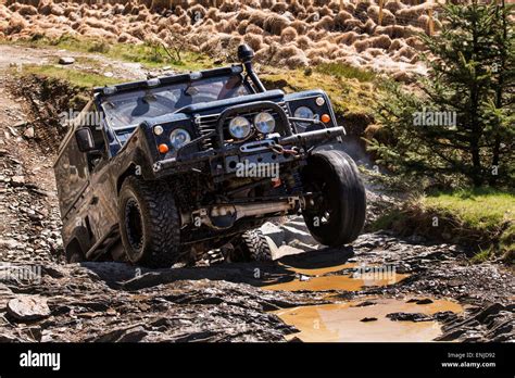 Land rover defender off road landrover defender off road Stock Photo - Alamy