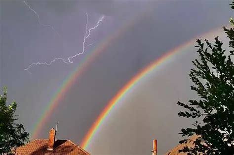 Watch - Forked lightning and double rainbow in astonishing pictures as freak storm hits ...