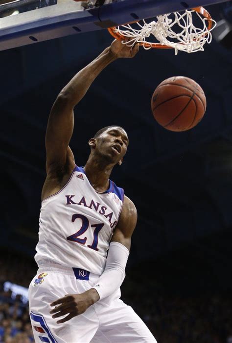 Kansas center Joel Embiid delivers on a dunk against Towson during the second half on Friday ...