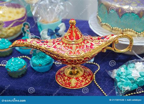 Aladdin Lamp of Wishes on Table . Aladdin S Magic Genie Lamp in Red and Gold on a Blue ...