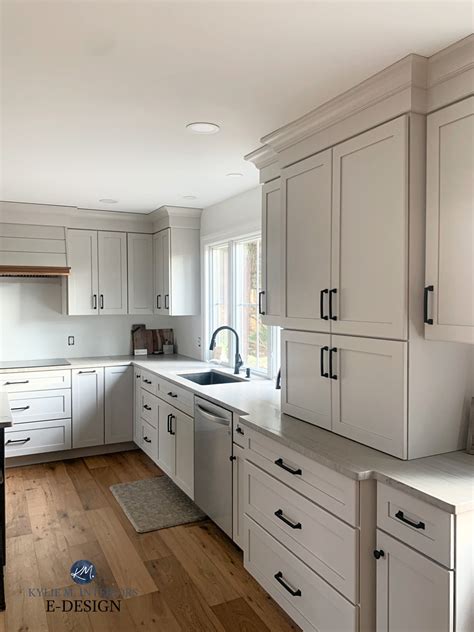 Transform Your Kitchen with White Cabinets, Black Countertops, and Wood ...