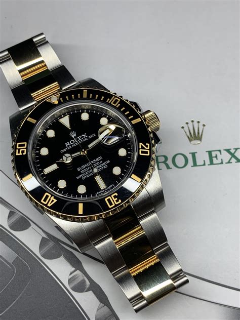 ROLEX SUBMARINER STAINLESS STEEL AND 18CT YELLOW GOLD 116613LN - Carr ...