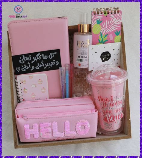 a pink hello kitty gift box filled with personal care items and writing utensils