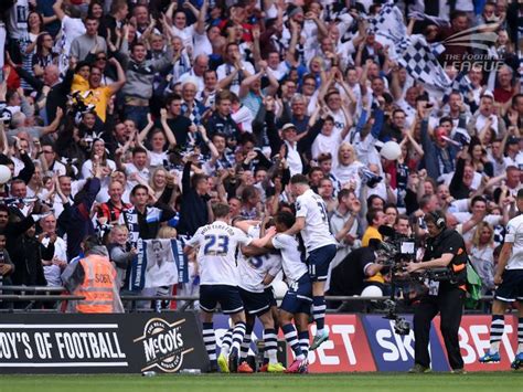 Preston North End players celebrate their fourth and final goal of the afternoon in front of ...