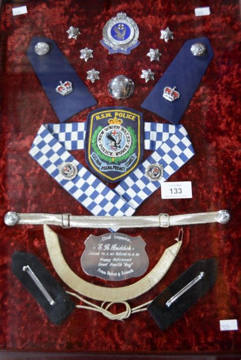 Framed collection of NSW Police officer's badges,