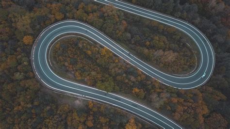 Aerial view of curved road on southern Poland mountains during autumn ...