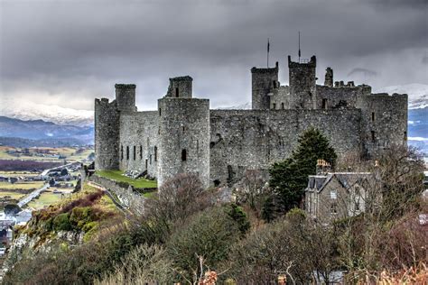 Harlech Castle, with the North Wales mountains providing a snow covered ...