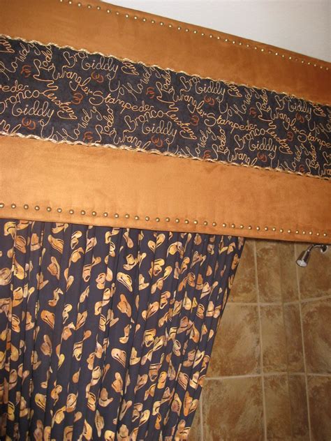 Covered cornice board with faux suede and fabric, trimmed with tacks. The final touch was rope ...