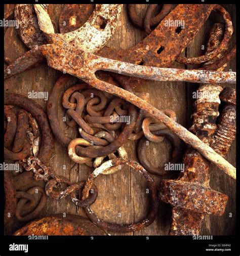 Rusty metal objects collected on a wooden barrel, Catalonia, Spain Stock Photo - Alamy