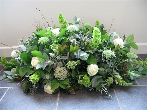 A casket with a natural feel, including thistles, cow parsley and ...