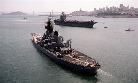 USS New Jersey (BB-62) moving past USS ENTERPRISE (CVN 65) in San ...