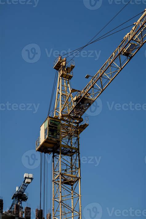 yellow tower crane 11250652 Stock Photo at Vecteezy