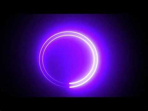 a purple light in the dark with a circular shape on it's side and an orange ring at the center