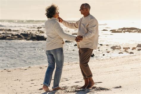 Happy elderly couple dancing together at the beach Photo (269498 ...