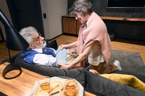 Gray-haired Wife Measures the Pressure of Her Husband with Tonometer ...