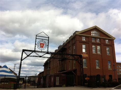 an old brick building with a basketball hoop on top