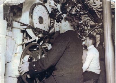 A photograph showing crew working inside of a submarine control room; SHHMG:A884... | eHive