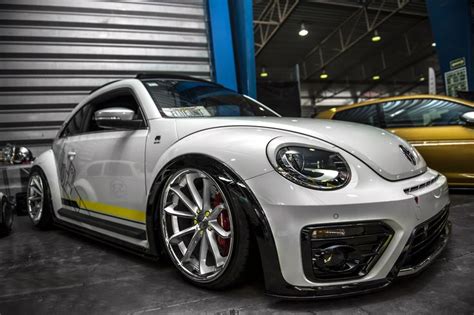 Customized to Impress: White Volkswagen Beetle Dressed in Aftermarket ...