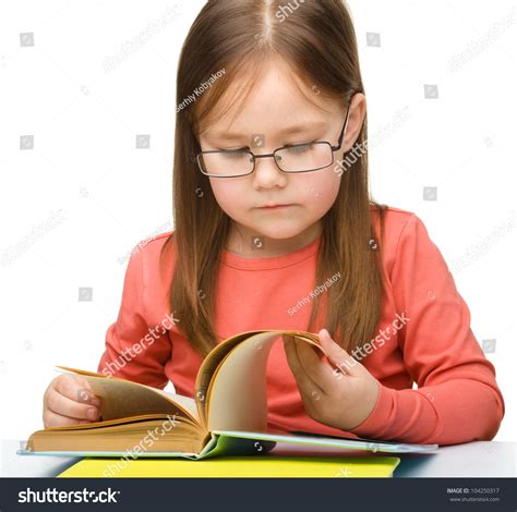 Cute Little Girl Reading Book Wearing Glasses, Isolated Over White Stock Photo 104250317 ...