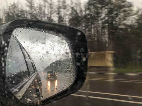 Rain Drops and Reflection of a Car on Mirror Stock Image - Image of ...