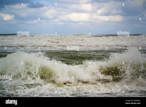 Big wave in surf in stormy sea, windy weather on sand beach. Amoudara,Crete,Greek Stock Photo ...