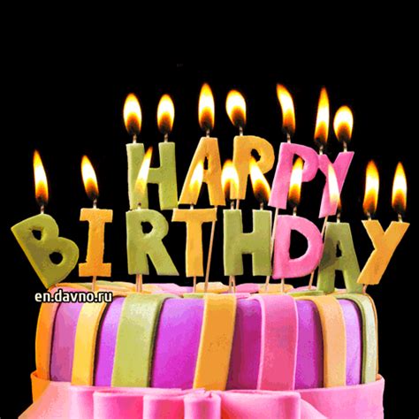 A birthday cake with colorful frosting and lit candles | Funimada.com