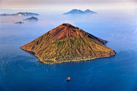 An aerial view of northeastern Stromboli, with the islands of Panarea, Salina, Lipari, Vulcano ...